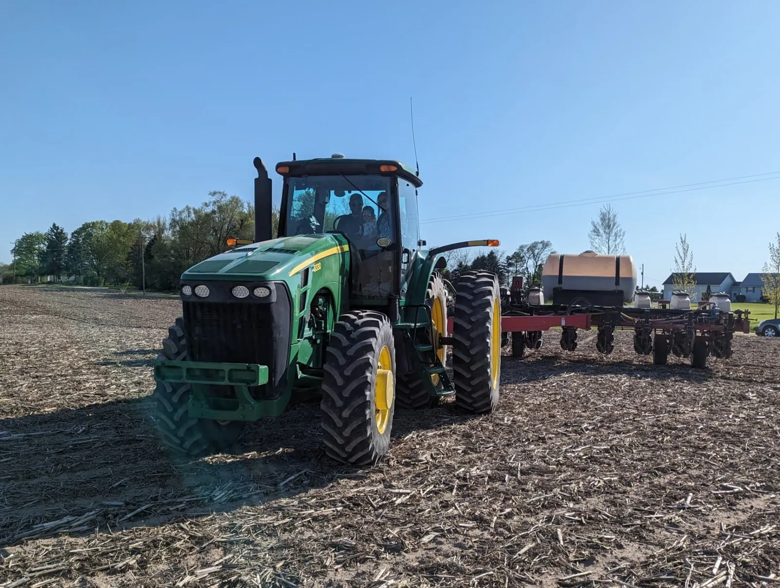 Liquid fertilizer tanks mounted on a planter in a Michigan field